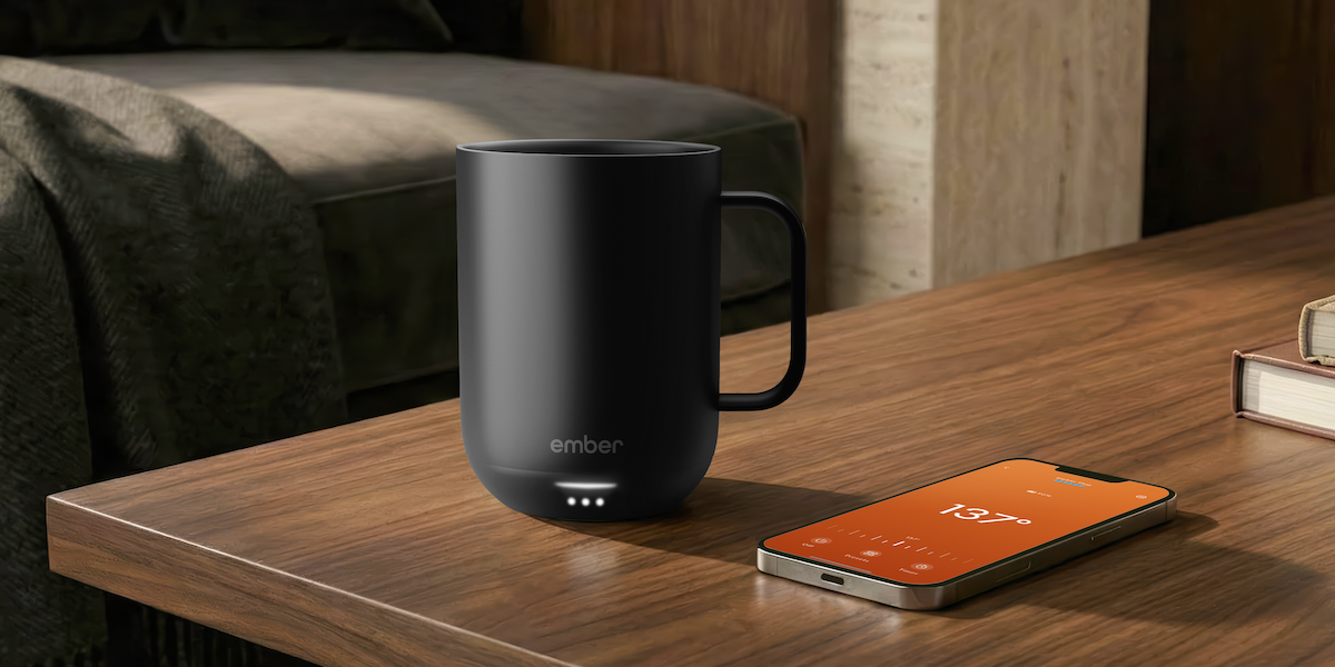 The sleek Ember Mug 3 on a desk.